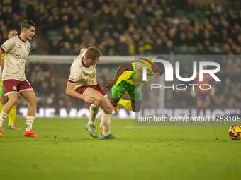 Forson Amankwah of Norwich City is tackled by Max Bird of Bristol City during the Sky Bet Championship match between Norwich City and Bristo...