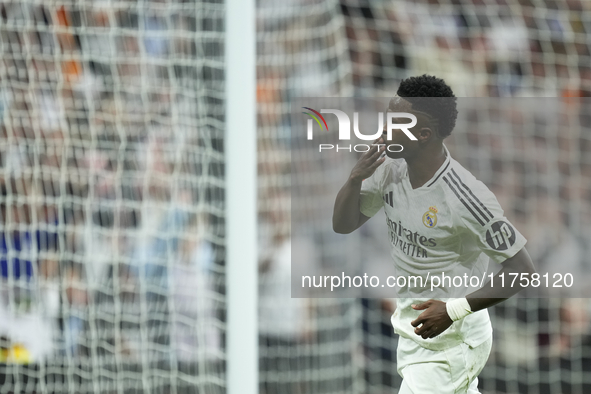 Vinicius Junior left winger of Real Madrid and Brazil celebrates after scoring his sides first goal during the La Liga match between Real Ma...