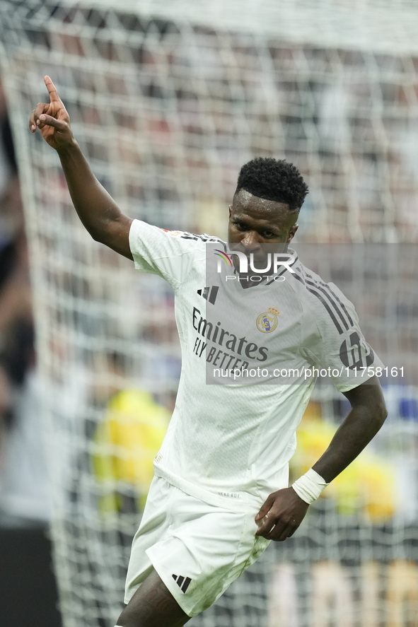 Vinicius Junior left winger of Real Madrid and Brazil celebrates after scoring his sides first goal during the La Liga match between Real Ma...