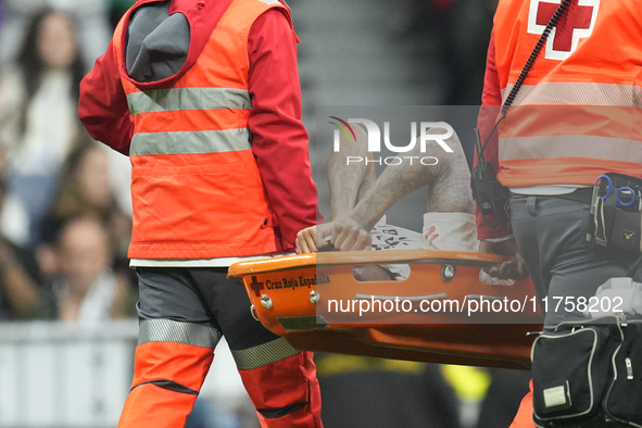 Eder Militao centre-back of Real Madrid and Brazil dejected after his injury during the La Liga match between Real Madrid CF and CA Osasuna...