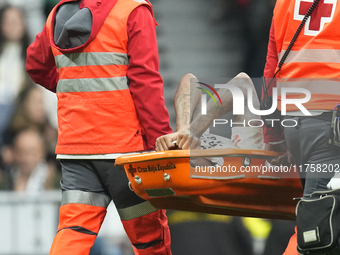 Eder Militao centre-back of Real Madrid and Brazil dejected after his injury during the La Liga match between Real Madrid CF and CA Osasuna...