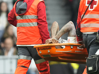 Eder Militao centre-back of Real Madrid and Brazil dejected after his injury during the La Liga match between Real Madrid CF and CA Osasuna...