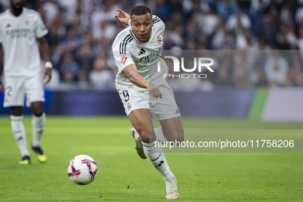 Kylian Mbappe of Real Madrid CF is in action with the ball during the La Liga EA Sports 2024/25 football match between Real Madrid CF and CA...