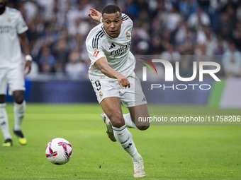 Kylian Mbappe of Real Madrid CF is in action with the ball during the La Liga EA Sports 2024/25 football match between Real Madrid CF and CA...