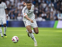 Kylian Mbappe of Real Madrid CF is in action with the ball during the La Liga EA Sports 2024/25 football match between Real Madrid CF and CA...