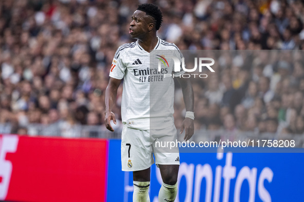 Vinicius Junior of Real Madrid CF protests during the La Liga EA Sports 2024/25 football match between Real Madrid CF and CA Osasuna at Esta...