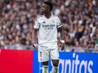 Vinicius Junior of Real Madrid CF protests during the La Liga EA Sports 2024/25 football match between Real Madrid CF and CA Osasuna at Esta...