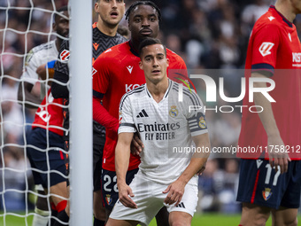 Lucas Vazquez of Real Madrid CF (right) fights for the position against Flavien Boyomo of CA Osasuna (left) during the La Liga EA Sports 202...