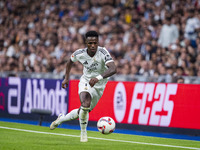 Vinicius Junior of Real Madrid CF is in action with the ball during the La Liga EA Sports 2024/25 football match between Real Madrid CF and...