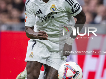 Vinicius Junior of Real Madrid CF is in action with the ball during the La Liga EA Sports 2024/25 football match between Real Madrid CF and...