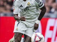 Vinicius Junior of Real Madrid CF is in action with the ball during the La Liga EA Sports 2024/25 football match between Real Madrid CF and...