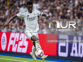 Vinicius Junior of Real Madrid CF is in action with the ball during the La Liga EA Sports 2024/25 football match between Real Madrid CF and...