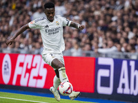 Vinicius Junior of Real Madrid CF is in action with the ball during the La Liga EA Sports 2024/25 football match between Real Madrid CF and...