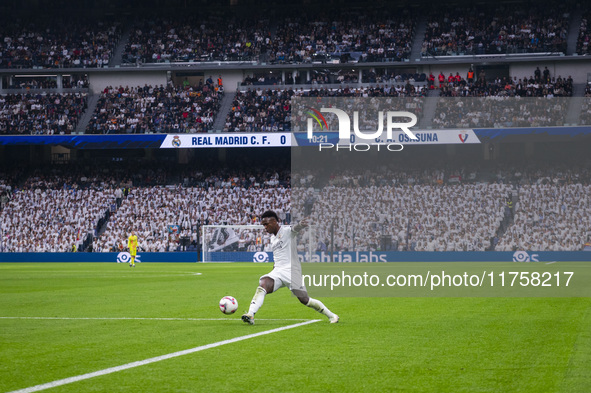 Vinicius Junior of Real Madrid CF is in action with the ball during the La Liga EA Sports 2024/25 football match between Real Madrid CF and...