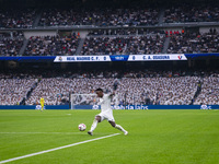 Vinicius Junior of Real Madrid CF is in action with the ball during the La Liga EA Sports 2024/25 football match between Real Madrid CF and...