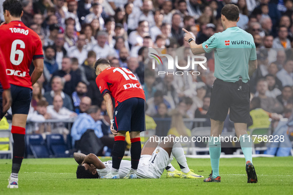 Rodrygo Silva de Goes of Real Madrid CF is injured on the ground during the La Liga EA Sports 2024/25 football match between Real Madrid CF...