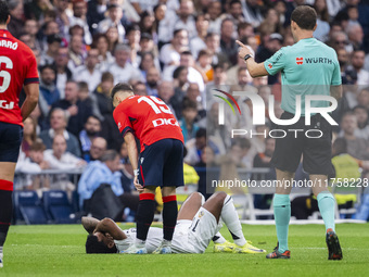 Rodrygo Silva de Goes of Real Madrid CF is injured on the ground during the La Liga EA Sports 2024/25 football match between Real Madrid CF...