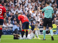 Rodrygo Silva de Goes of Real Madrid CF is injured on the ground during the La Liga EA Sports 2024/25 football match between Real Madrid CF...