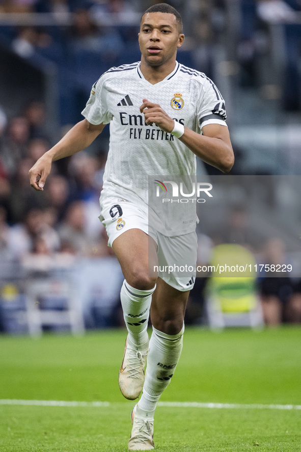 Kylian Mbappe of Real Madrid CF is in action with the ball during the La Liga EA Sports 2024/25 football match between Real Madrid CF and CA...