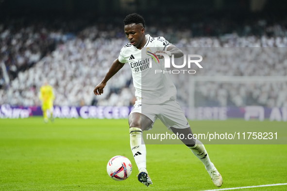 Vinicius Junior left winger of Real Madrid and Brazil controls the ball during the La Liga match between Real Madrid CF and CA Osasuna at Es...