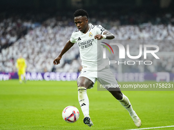 Vinicius Junior left winger of Real Madrid and Brazil controls the ball during the La Liga match between Real Madrid CF and CA Osasuna at Es...