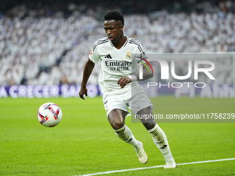 Vinicius Junior left winger of Real Madrid and Brazil controls the ball during the La Liga match between Real Madrid CF and CA Osasuna at Es...