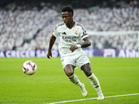 Vinicius Junior left winger of Real Madrid and Brazil controls the ball during the La Liga match between Real Madrid CF and CA Osasuna at Es...