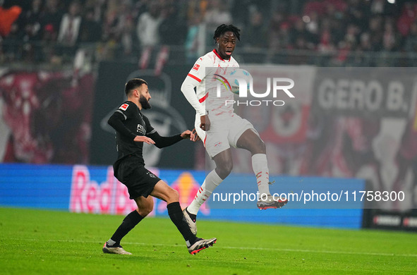 El Chadaille Bitshiabu of Leipzig  controls the ball during the Bundesliga match between RB Leipzig and Borussia Mönchengladbach at Red Bull...