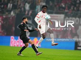 El Chadaille Bitshiabu of Leipzig  controls the ball during the Bundesliga match between RB Leipzig and Borussia Mönchengladbach at Red Bull...