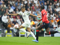 Kylian Mbappe centre-forward of Real Madrid and France and Enzo Boyomo centre-back of Osasuna and Cameroon during the La Liga match between...