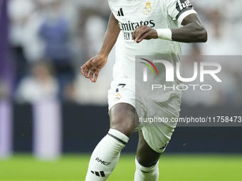 Vinicius Junior left winger of Real Madrid and Brazil in action during the La Liga match between Real Madrid CF and CA Osasuna at Estadio Sa...