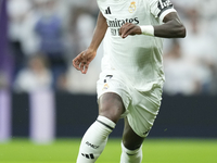 Vinicius Junior left winger of Real Madrid and Brazil in action during the La Liga match between Real Madrid CF and CA Osasuna at Estadio Sa...