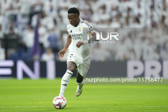 Vinicius Junior left winger of Real Madrid and Brazil in action during the La Liga match between Real Madrid CF and CA Osasuna at Estadio Sa...