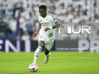 Vinicius Junior left winger of Real Madrid and Brazil in action during the La Liga match between Real Madrid CF and CA Osasuna at Estadio Sa...