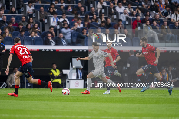 Brahim Diaz of Real Madrid CF (C) is in action with the ball during the La Liga EA Sports 2024/25 football match between Real Madrid CF and...