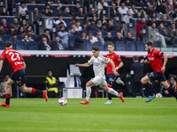 Brahim Diaz of Real Madrid CF (C) is in action with the ball during the La Liga EA Sports 2024/25 football match between Real Madrid CF and...