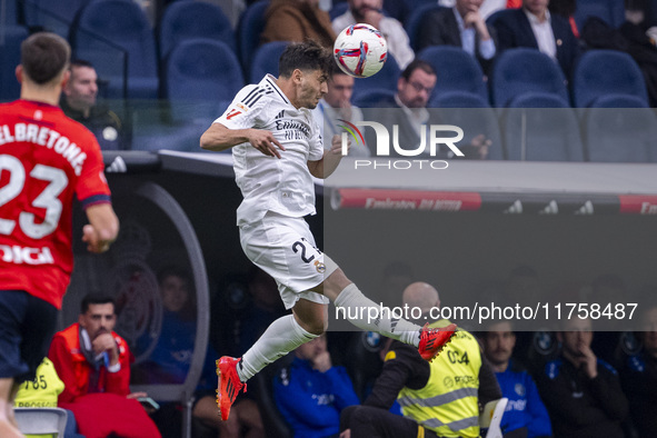 Brahim Diaz of Real Madrid CF heads the ball during the La Liga EA Sports 2024/25 football match between Real Madrid CF and CA Osasuna at Es...