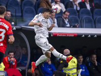 Brahim Diaz of Real Madrid CF heads the ball during the La Liga EA Sports 2024/25 football match between Real Madrid CF and CA Osasuna at Es...