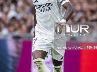 Vinicius Junior of Real Madrid CF is in action with the ball during the La Liga EA Sports 2024/25 football match between Real Madrid CF and...