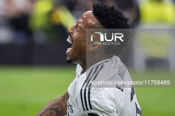 Eder Militao of Real Madrid CF is injured on the ground during the La Liga EA Sports 2024/25 football match between Real Madrid CF and CA Os...