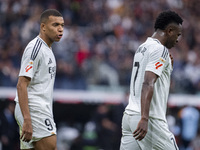 Kylian Mbappe of Real Madrid CF (left) talks to Vinicius Junior of Real Madrid CF (right) during the La Liga EA Sports 2024/25 football matc...