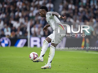 Vinicius Junior of Real Madrid CF is in action with the ball during the La Liga EA Sports 2024/25 football match between Real Madrid CF and...