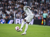 Vinicius Junior of Real Madrid CF is in action with the ball during the La Liga EA Sports 2024/25 football match between Real Madrid CF and...