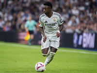 Vinicius Junior of Real Madrid CF is in action with the ball during the La Liga EA Sports 2024/25 football match between Real Madrid CF and...