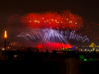 Fireworks illuminate the sky in Doha, Qatar, on November 9, 2024, on the last day of the inaugural Qatar Boat Show 2024 at Old Doha Port. Th...