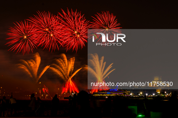 Fireworks illuminate the sky in Doha, Qatar, on November 9, 2024, on the last day of the inaugural Qatar Boat Show 2024 at Old Doha Port. Th...