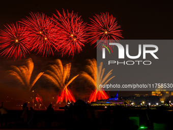 Fireworks illuminate the sky in Doha, Qatar, on November 9, 2024, on the last day of the inaugural Qatar Boat Show 2024 at Old Doha Port. Th...