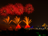 Fireworks illuminate the sky in Doha, Qatar, on November 9, 2024, on the last day of the inaugural Qatar Boat Show 2024 at Old Doha Port. Th...