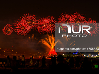 Fireworks illuminate the sky in Doha, Qatar, on November 9, 2024, on the last day of the inaugural Qatar Boat Show 2024 at Old Doha Port. Th...