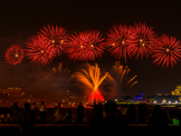 Fireworks illuminate the sky in Doha, Qatar, on November 9, 2024, on the last day of the inaugural Qatar Boat Show 2024 at Old Doha Port. Th...